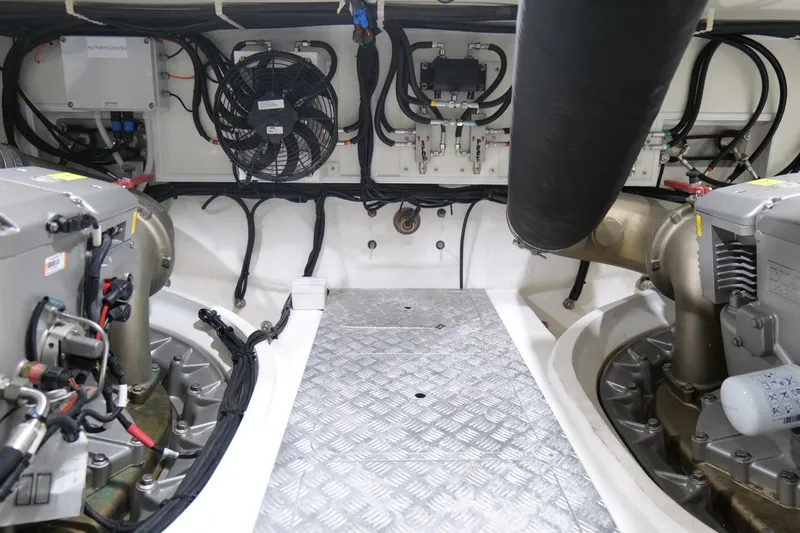 Slide: The Image of Engine room of 2022 Pearl 62 yacht with mechanical components and wiring. - 67