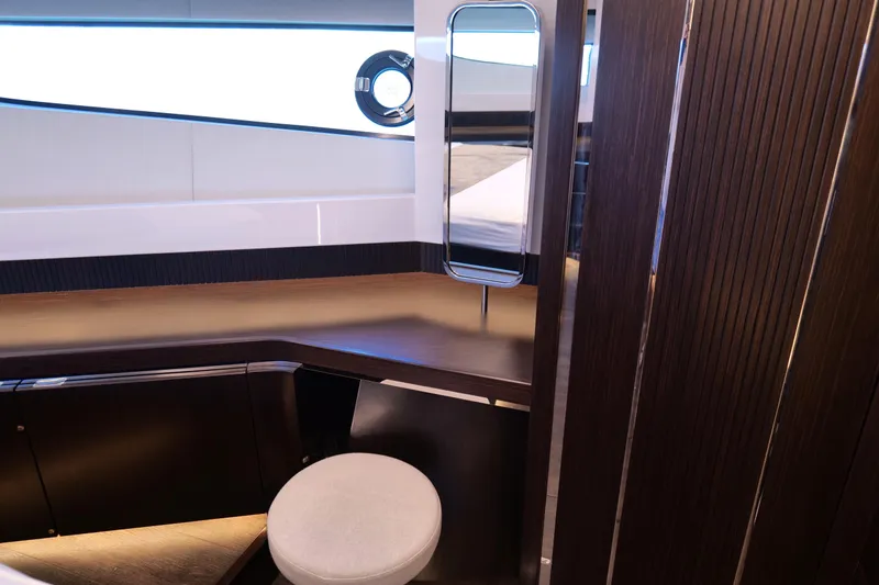 Slide: The Image of Luxurious interior of 2022 Pearl 62 yacht with modern wood finishes and seating. - 35