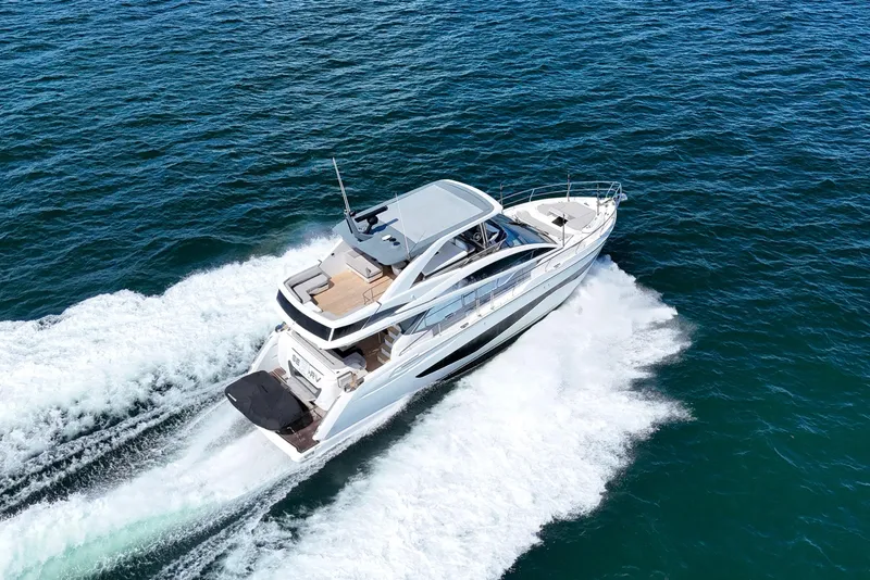Slide: The Image of Luxurious 2022 Pearl 62 yacht cruising on open sea, aerial view. - 73