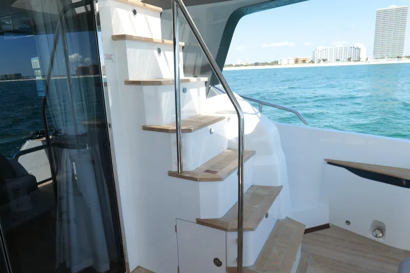 Slide: The Image of Staircase on 2022 Pearl 62 yacht with ocean view and modern design. - 44