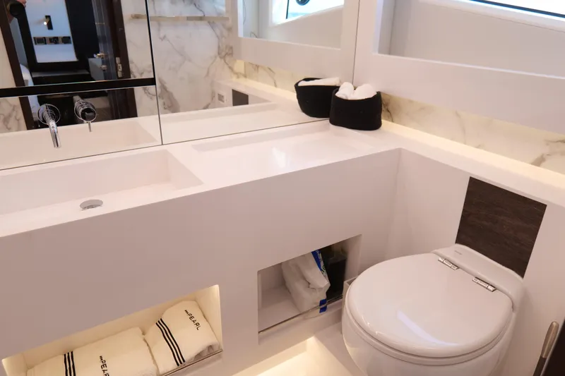 Slide: The Image of Luxurious bathroom in 2022 Pearl 62 yacht with modern fixtures and elegant design. - 29