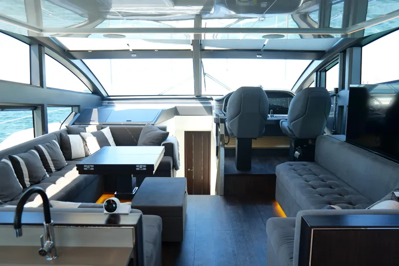 Slide: The Image of Luxurious interior of 2022 Pearl 62 yacht with modern seating and helm area. - 31