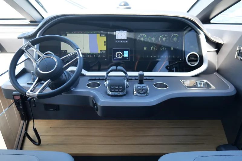 Slide: The Image of Modern helm of 2022 Pearl 62 yacht with advanced navigation controls. - 21