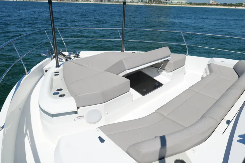 Slide: The Image of Luxurious 2022 Pearl 62 yacht with spacious sunbathing area on open sea. - 61