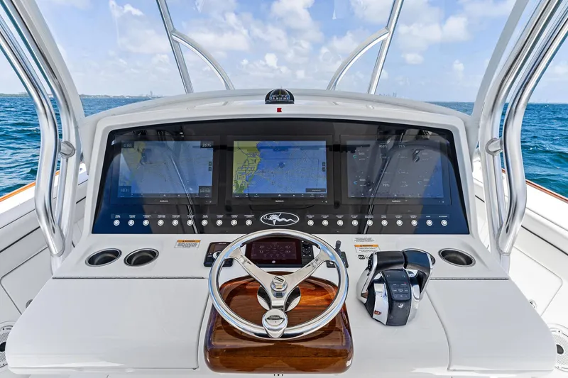 Slide: The Image of 2021 Valhalla Boatworks V-41 helm with advanced navigation displays and controls. - 22