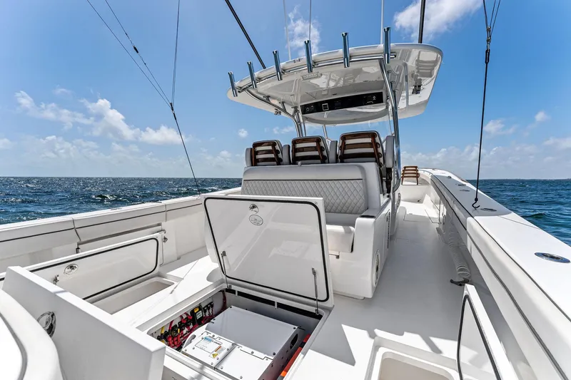 Slide: The Image of 2021 Valhalla Boatworks V-41, open deck, luxurious seating, ocean backdrop, sunny day. - 19