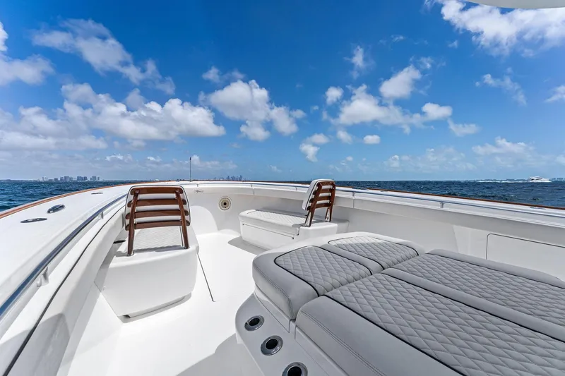 Slide: The Image of 2021 Valhalla Boatworks V-41 yacht with luxurious seating, ocean view, and clear blue sky. - 29