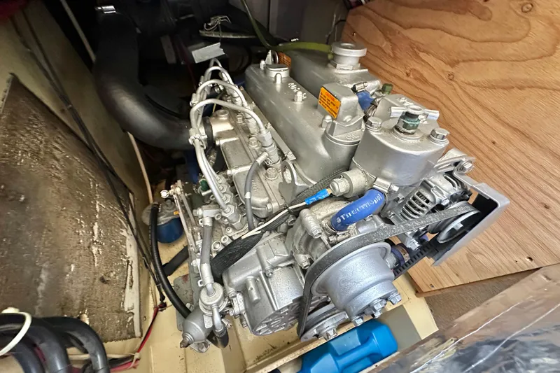 Slide: The Image of Engine of a 1976 Islander 36 sailboat, showcasing mechanical components and details. - 21