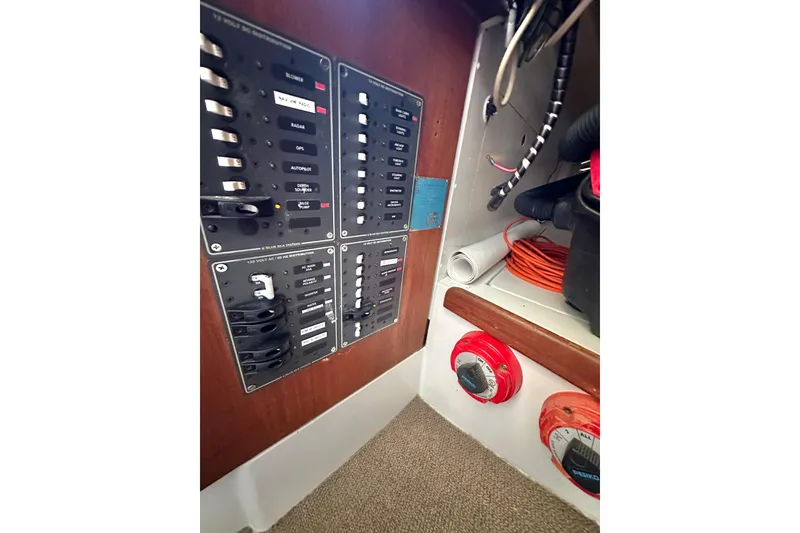 Slide: The Image of Electrical panel and wiring inside a 1976 Islander 36 sailboat. - 19