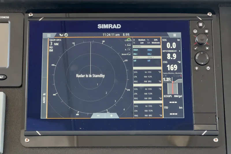 Slide: The Image of A Simrad radar screen displays 'Radar in Standby,' surrounded by various navigation data. - 31