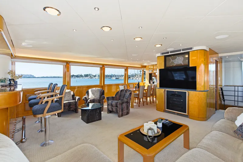 Slide: The Image of Luxurious salon with large windows, comfortable chairs, and a bar. View of the harbor. - 14