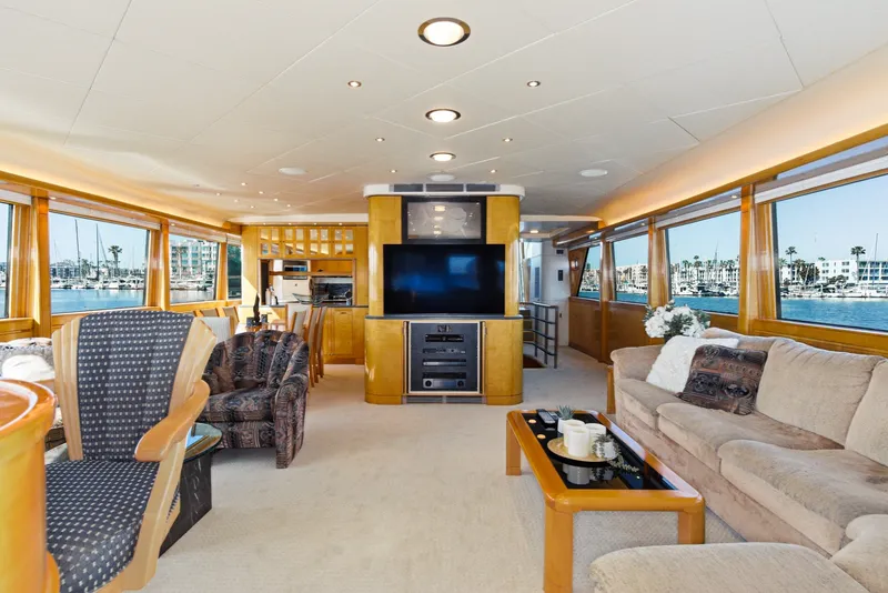 Slide: The Image of Luxurious salon with large windows, comfortable sofas, and a big TV aboard a Westport Crescent yacht. - 15