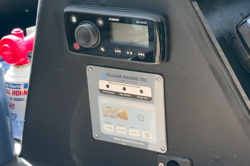 Slide: The Image of A control panel with a Fusion audio system and a water purification control panel. - 35