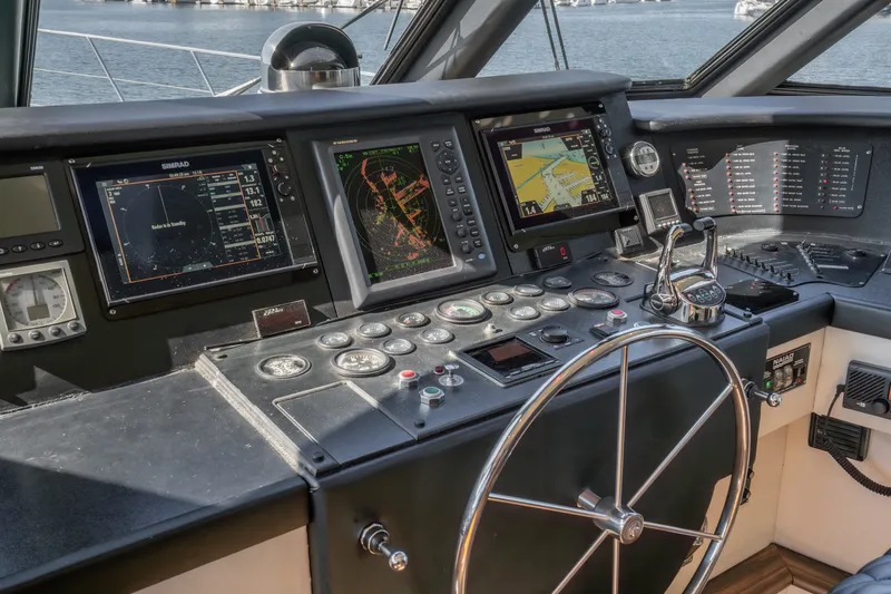 Slide: The Image of The image shows the helm of a 1990 Westport Crescent with modern navigation instruments. - 29