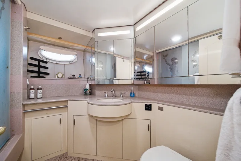 Slide: The Image of The image shows an elegant yacht bathroom with mirrors and modern fixtures. - 46