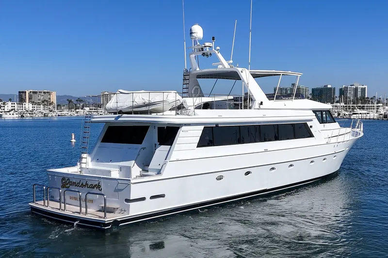 Slide: The Image of A luxurious white yacht sits calmly on the water, with a clear blue sky in the background. - 3