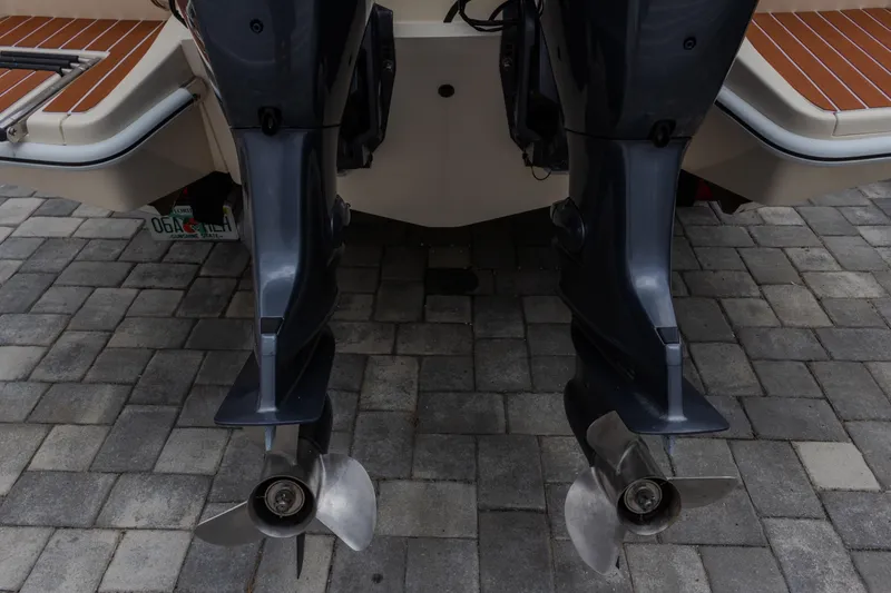 Slide: The Image of Rear view of 2014 Scout 245 XSF boat with dual outboard motors. - 15