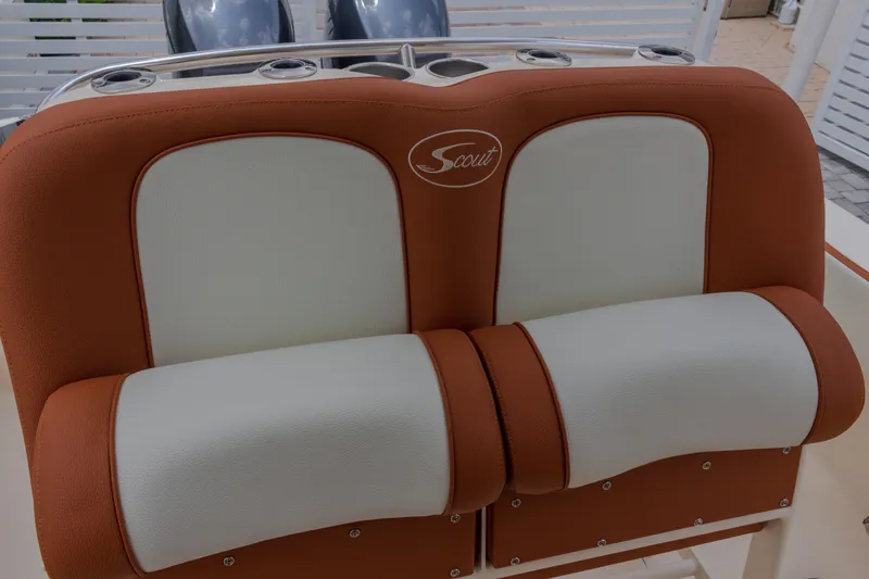 Slide: The Image of 2014 Scout 245 XSF boat seat with brown and white upholstery. - 6