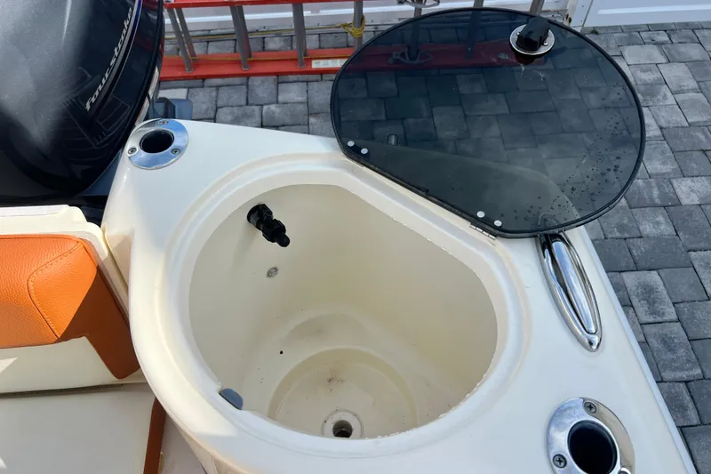 Slide: The Image of 2014 Scout 245 XSF boat livewell with open lid and seating detail. - 46
