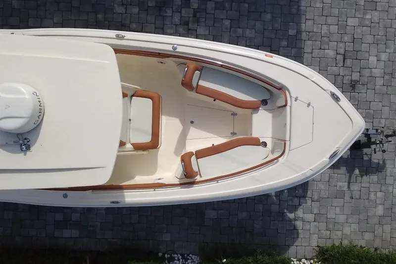 Slide: The Image of Overhead view of 2014 Scout 245 XSF boat on paved surface. - 11