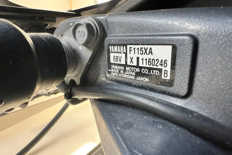 Slide: The Image of Yamaha F115XA engine label on 2014 Scout 245 XSF boat, close-up view. - 36