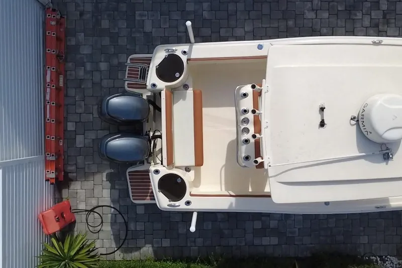 Slide: The Image of Overhead view of a 2014 Scout 245 XSF boat on a paved surface. - 10