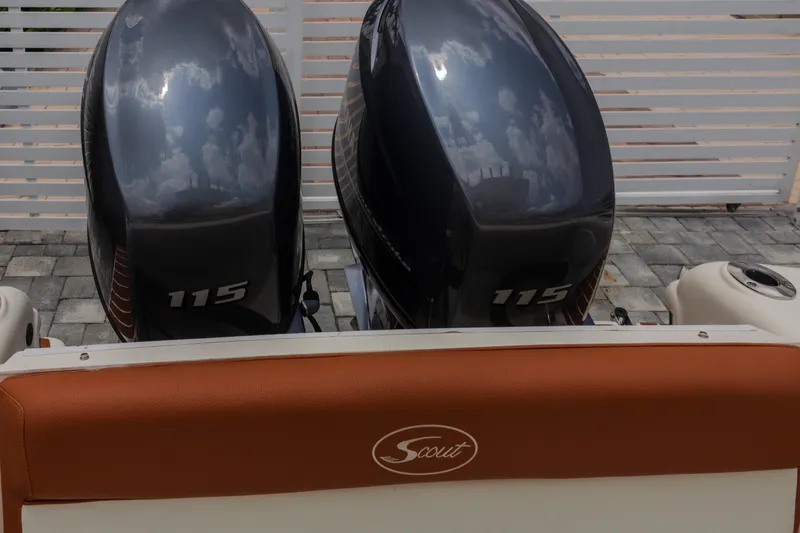 Slide: The Image of 2014 Scout 245 XSF boat with dual 115 horsepower engines, rear view. - 16