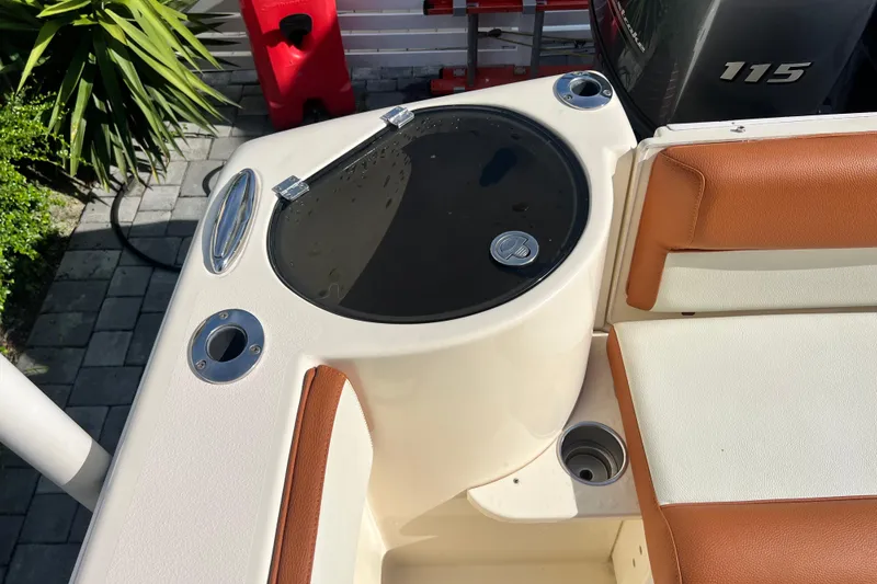 Slide: The Image of 2014 Scout 245 XSF boat interior with seating and storage compartment. - 47