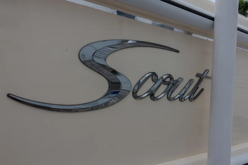 Slide: The Image of Scout 245 XSF 2014 boat logo in sleek chrome lettering on beige background. - 17