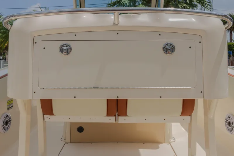 Slide: The Image of 2014 Scout 245 XSF boat console with storage compartment and seating. - 21