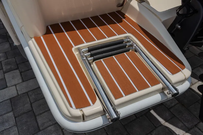 Slide: The Image of 2014 Scout 245 XSF boat swim platform with foldable ladder and teak-style decking. - 10