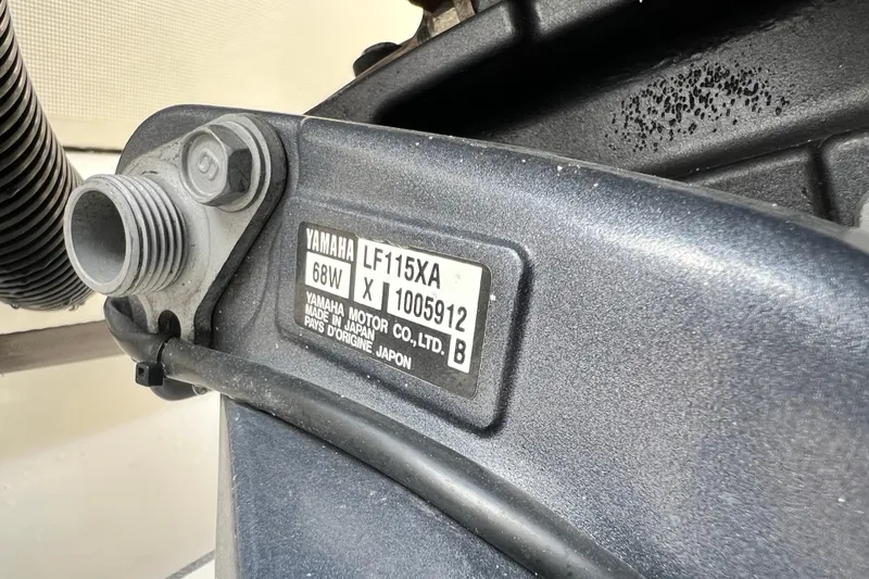 Slide: The Image of Close-up of a Yamaha LF115XA engine label on a 2014 Scout 245 XSF boat. - 39