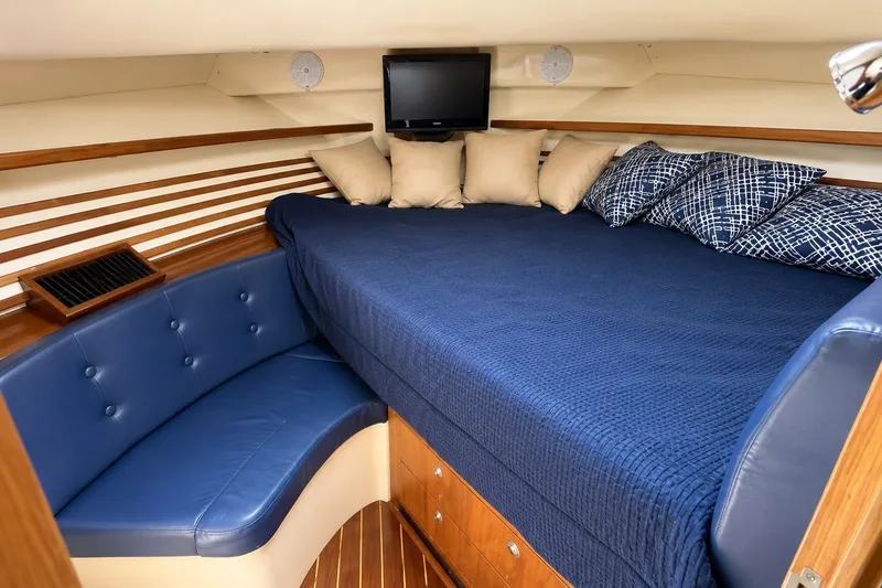 Slide: The Image of Luxurious cabin interior of 2005 Compton 33 Downeast Express with blue bedding and seating. - 11