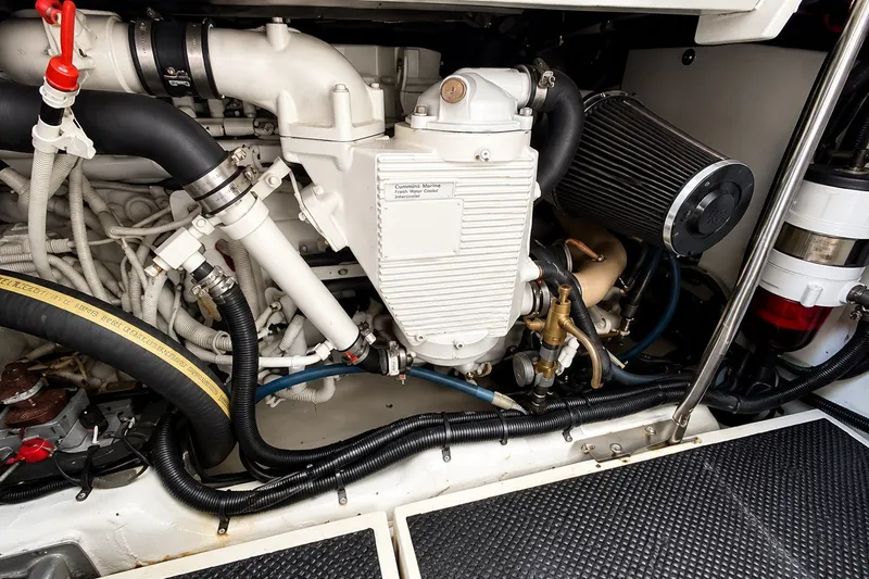 Slide: The Image of Engine compartment of a 2005 Compton 33 Downeast Express boat, showcasing detailed components. - 24