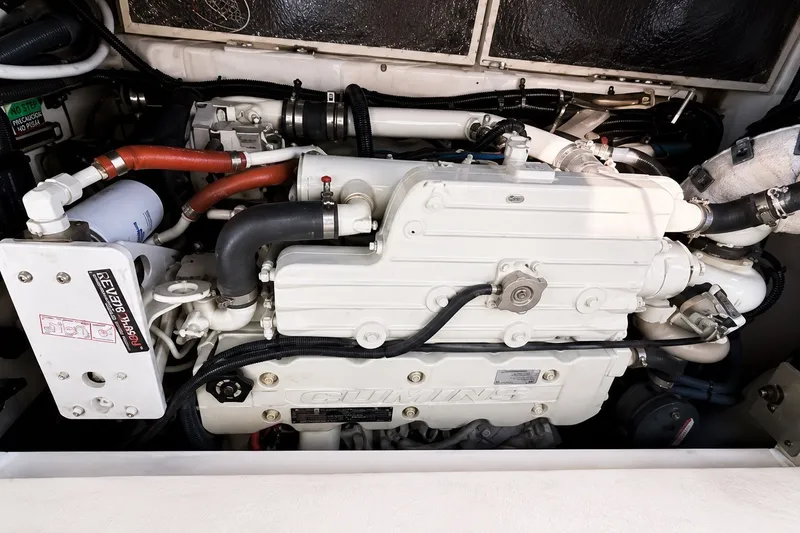 Slide: The Image of Engine of a 2005 Compton 33 Downeast Express boat, showcasing intricate mechanical components. - 23