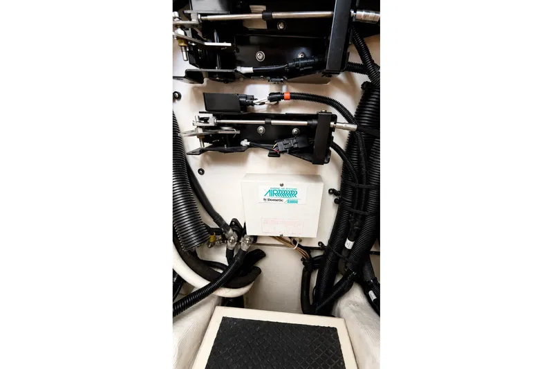 Slide: The Image of Engine compartment of a 2005 Compton 33 Downeast Express with wiring and mechanical components. - 22