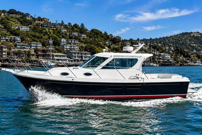 The Image of 2005 Compton 33 Downeast Express cruising on scenic coastal waters. - 0