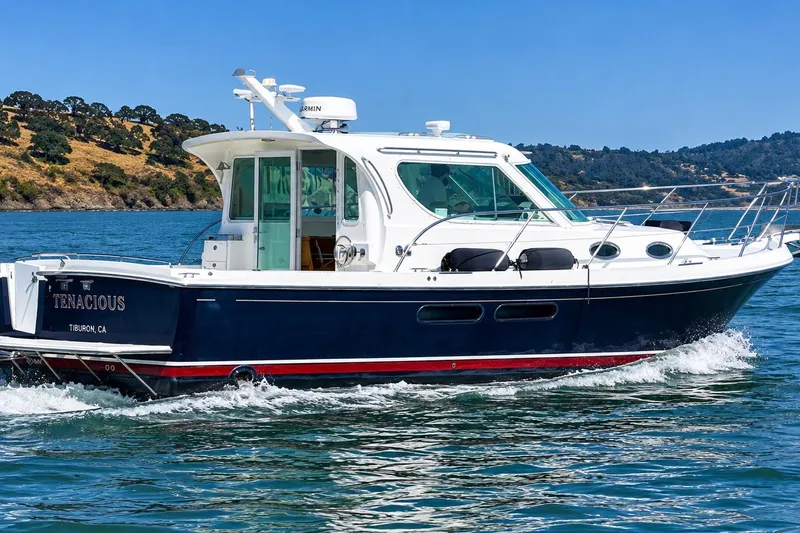 Slide: The Image of 2005 Compton 33 Downeast Express boat cruising on a sunny day near Tiburon, CA. - 1