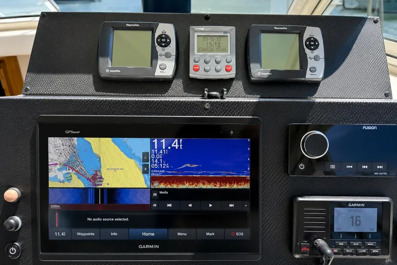 Slide: The Image of Dashboard of a 2005 Compton 33 Downeast Express with navigation and communication equipment. - 8