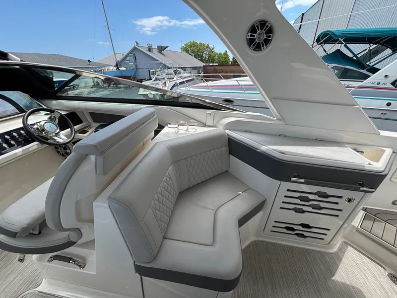 Slide: The Image of The image shows the cockpit of a 2024 Sea Ray SLX 310 with sleek seating and modern features. - 4