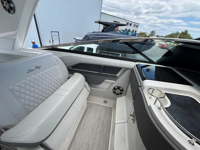 Slide: The Image of The image shows the interior of a 2024 Sea Ray SLX 310 boat with sleek seating. - 6