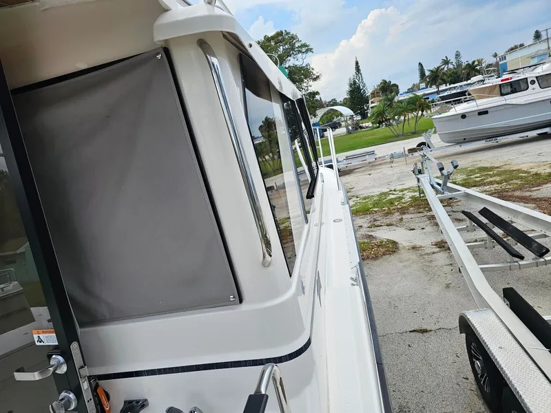 Slide: The Image of A 2021 Cutwater C-28 boat is on a trailer in a marina area. - 11