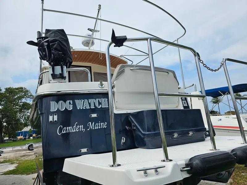 Slide: The Image of A 2021 Cutwater C-28 boat named "Dog Watch" from Camden, Maine, is on land. - 6