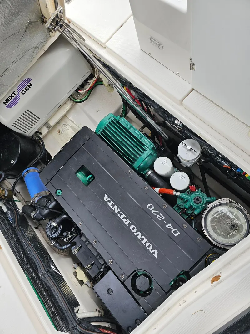 Slide: The Image of The engine compartment of a 2021 Cutwater C-28 features a Volvo Penta D4-270 engine. - 13
