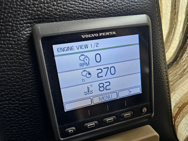 Slide: The Image of A Volvo Penta engine display screen shows RPM, hours, and temperature. - 14