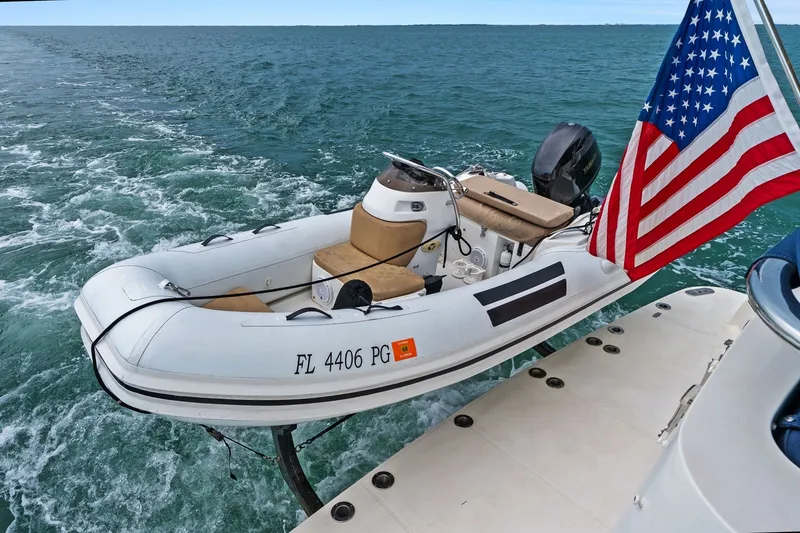 Slide: The Image of Inflatable boat with American flag on water, Hampton Endurance 2015 model. - 90