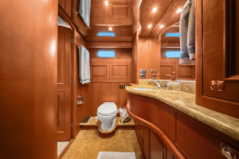 Slide: The Image of Luxurious 2015 Hampton Endurance yacht bathroom with wooden cabinetry and elegant fixtures. - 37