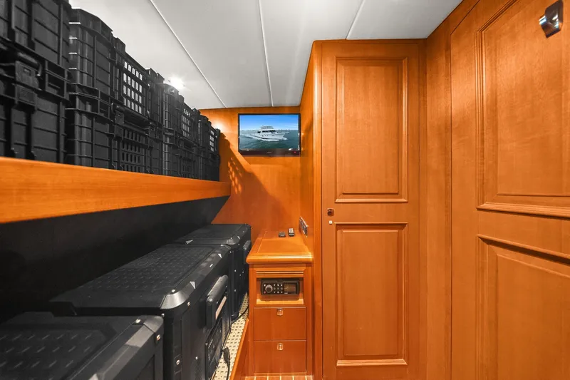 Slide: The Image of Luxurious wooden interior of 2015 Hampton Endurance yacht with storage and wall-mounted screen. - 55