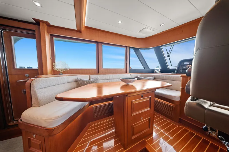 Slide: The Image of Luxurious interior of 2015 Hampton Endurance yacht with elegant wood finishes and panoramic windows. - 16