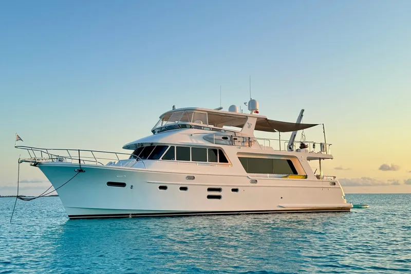 Slide: The Image of 2015 Hampton Endurance yacht on tranquil ocean at sunset. - 1